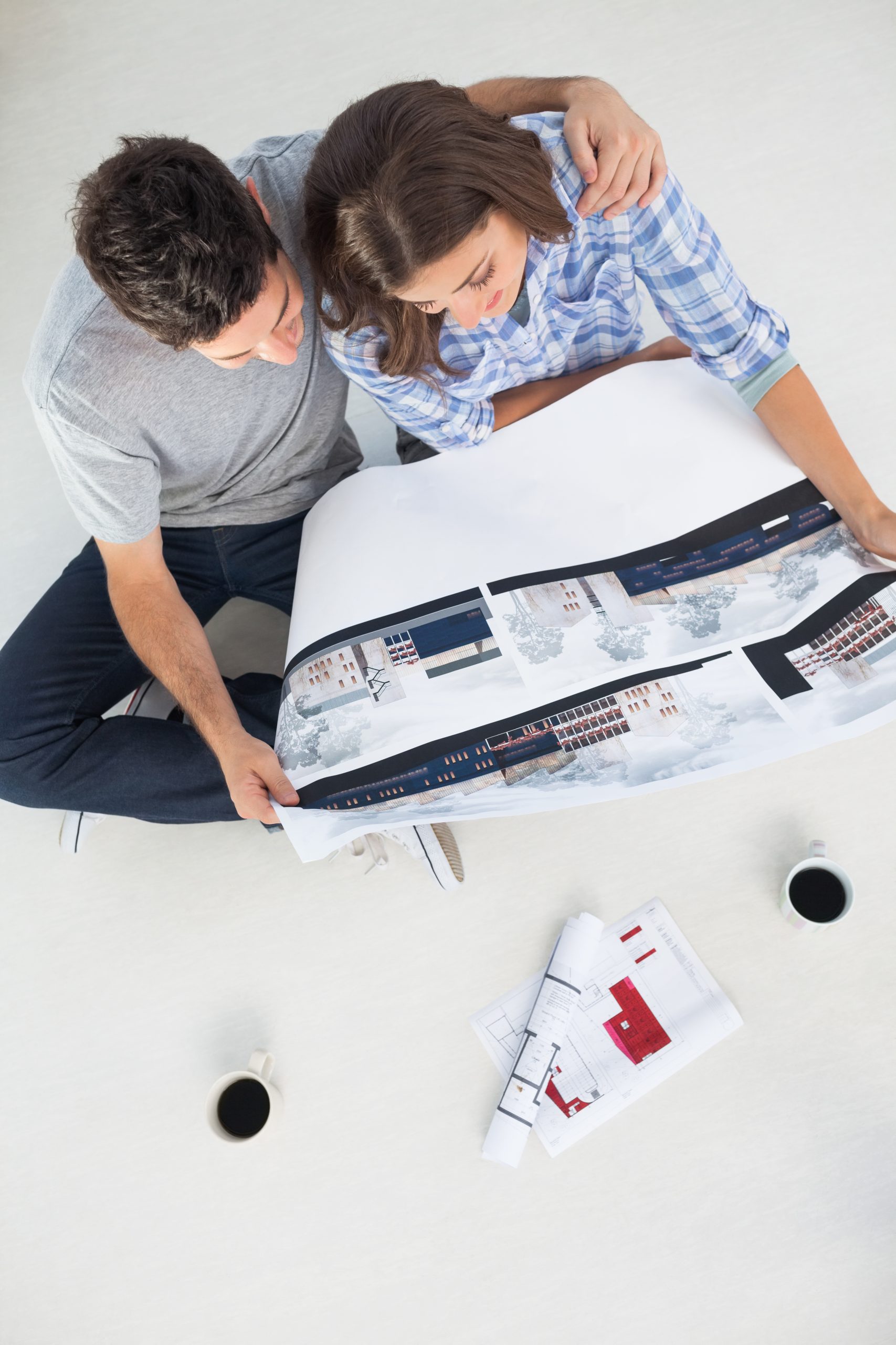Home Architecture 147 overview man his wife holding house plan scaled