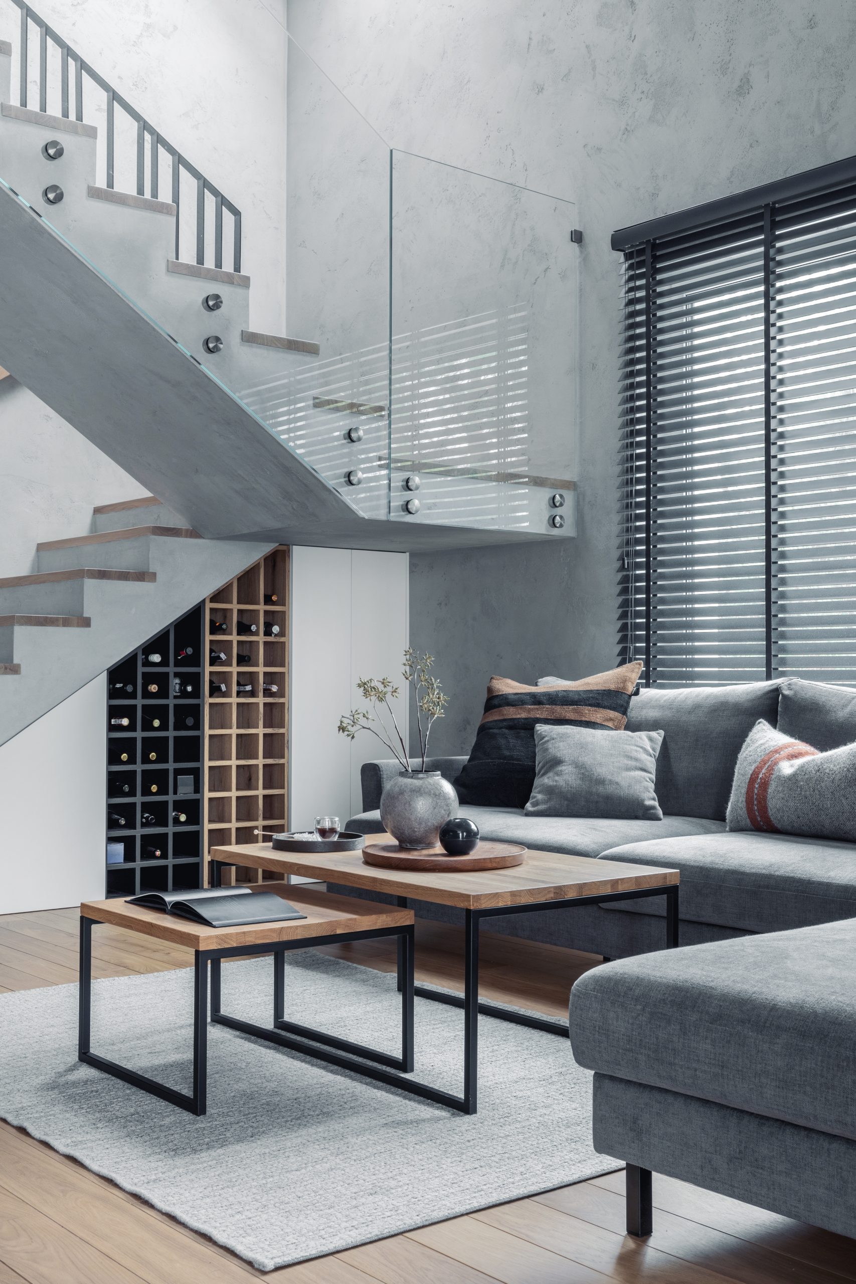 About 1 stylish composition living room interior with corner grey sofa green velvet armchair coffee table wooden floor design furniture personal accessories modern home decor template scaled